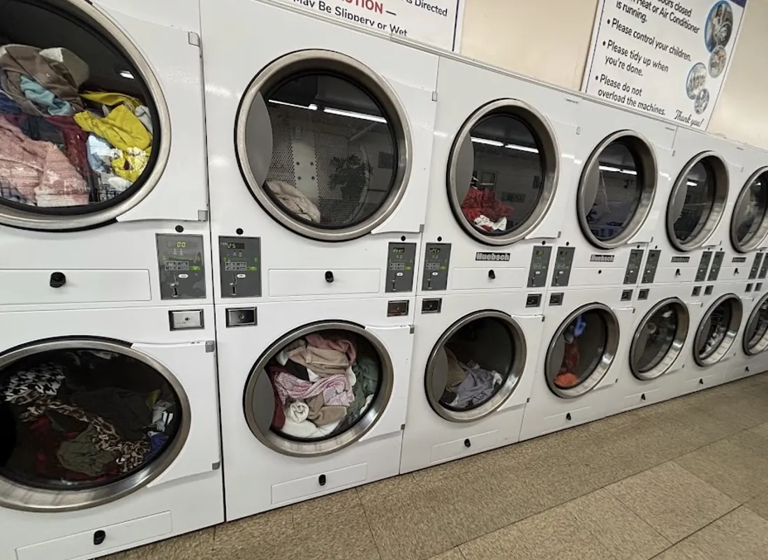 Stacked dryers with laundry inside